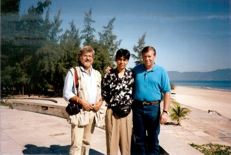 Gunner Henderson (right) with Viet Nam foreign ministry representative Chong Huang (center) and Time-Life photojournalist Dirck Halstead at China Beach near Da Nang, Viet Nam, 1994. Henderson and Halstead traveled to Saigon on assignment for LIFE magazine, and once that job was finished, they travelled the entire length of Viet Nam videotaping interviews about the last days of the Vietnam War. It was from these exhaustive interviews both in Viet Nam and elsewhere in the world, interviewing both sides of the war, including interviews with former President Gerald Ford, that Henderson wrote his award winning nonfiction book about the fall of South Vietnam and end of the war, Goodnight Saigon.