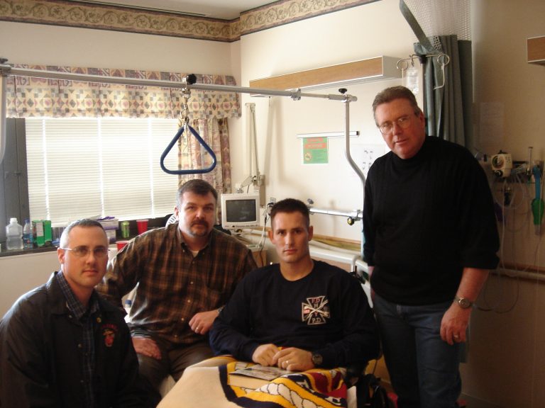 March of 2007: Visiting wounded Marine Scout-Snipers at the Naval Regional Medical Center, Bethesda, Maryland. Gave out free books, personally inscribed. Accompanied by US Marine Corps Scout-Sniper Association President, Allen Boothby (left-center) and Vice President Robert J. Reidsma, then Senior Instructor, Marine Corps Scout-Sniper Instructor School, Quantico, VA. Wounded Marine Scout-Sniper (right-center) Kenneth Dylan Gray. Gunner Charles Henderson (standing right).