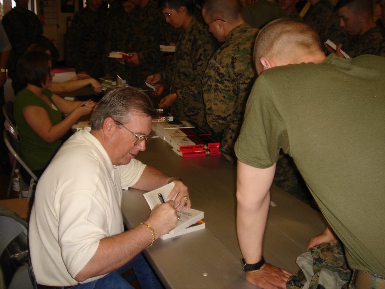 Autographing books for Marines at Camp Lejeune, NC, 2007